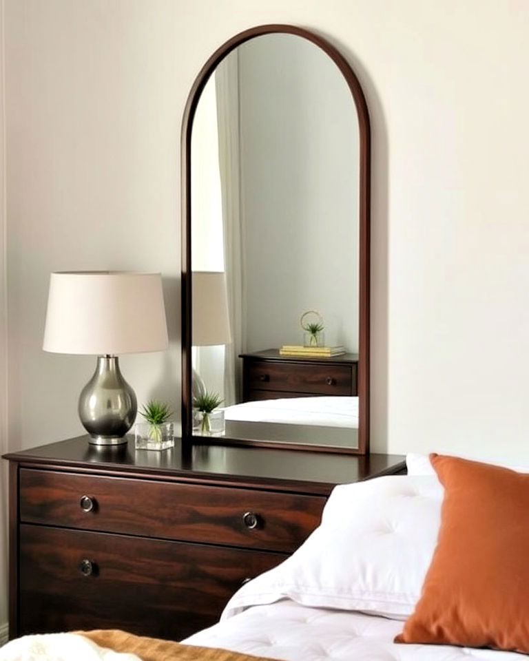 elegant arch shaped mirror behind nightstand - 15 Mirror Behind Nightstand Design Ideas