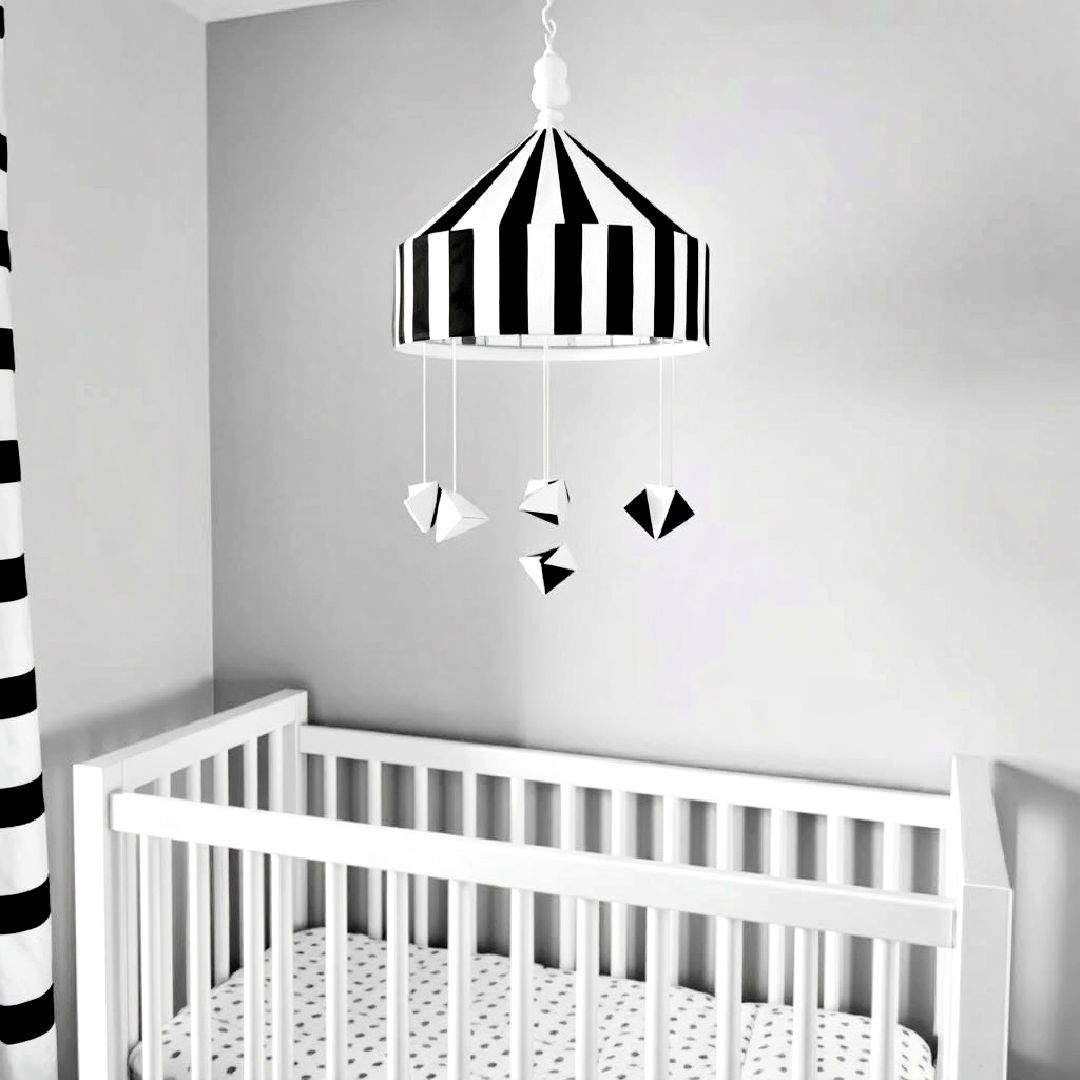 hang black and white striped mobile - 25 Black and White Nursery Ideas