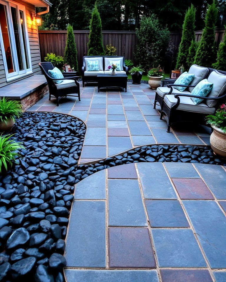 patio space with black river rock landscape - 20 Black River Rock Landscaping Ideas