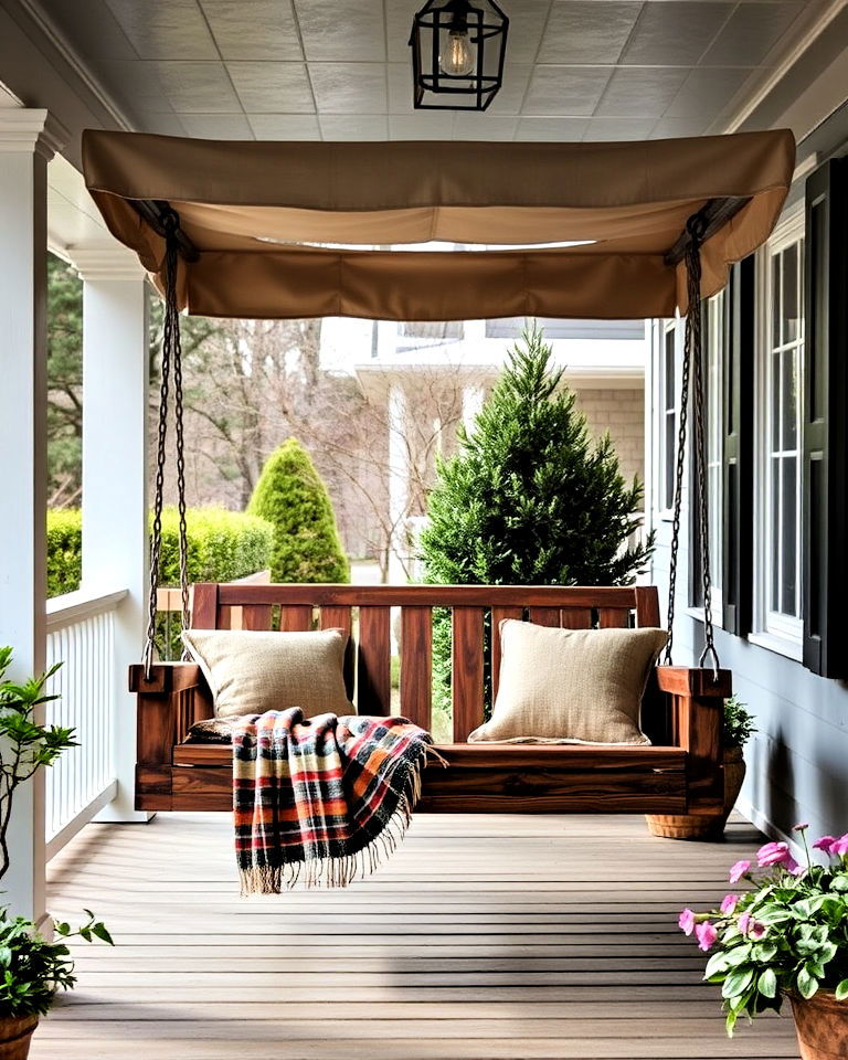 rustic porch swing with shaded canopy - 30 Rustic Porch Ideas