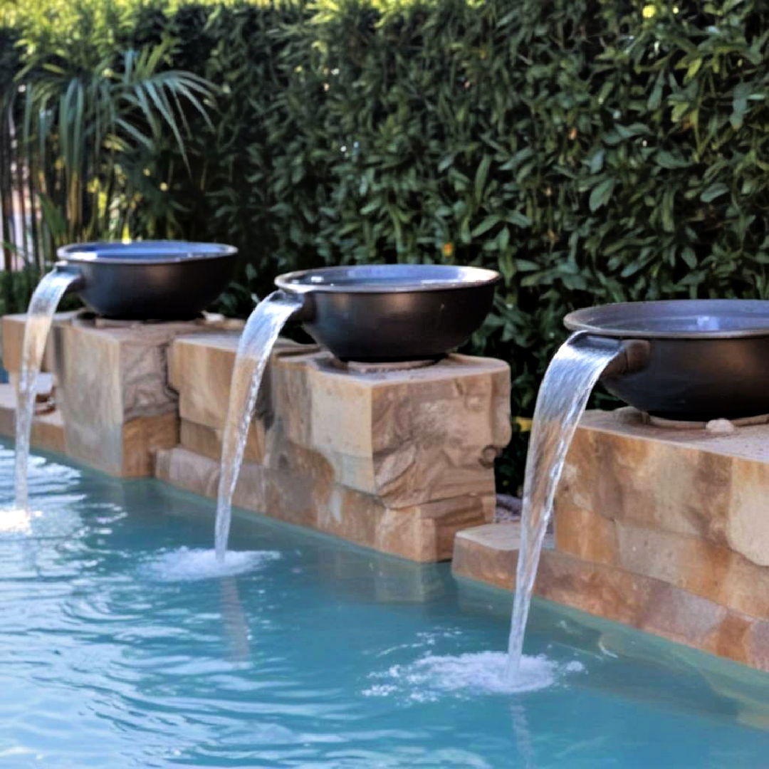 water bowls placed on pool edge - 15 Pool Fountain Ideas