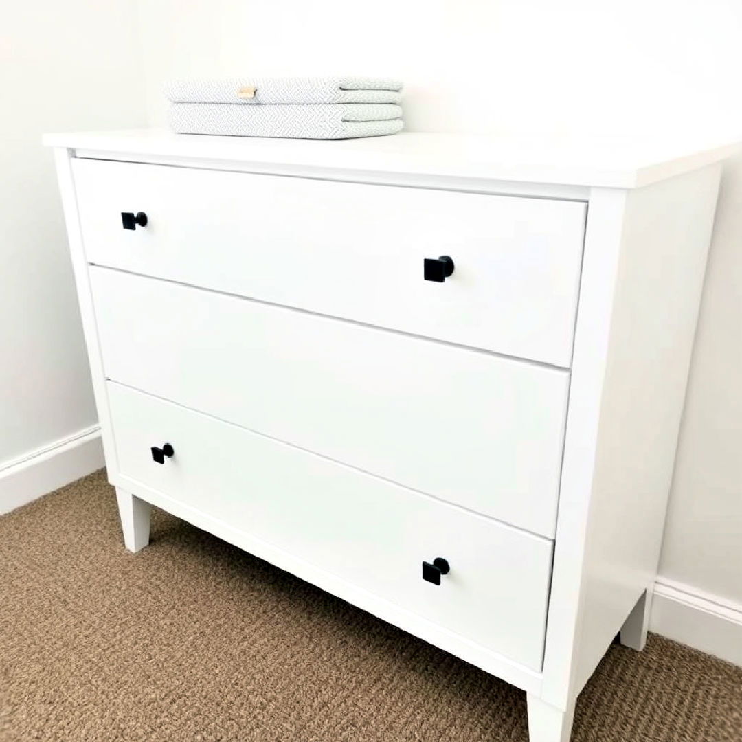 white dresser with black geometric knobs - 25 Black and White Nursery Ideas