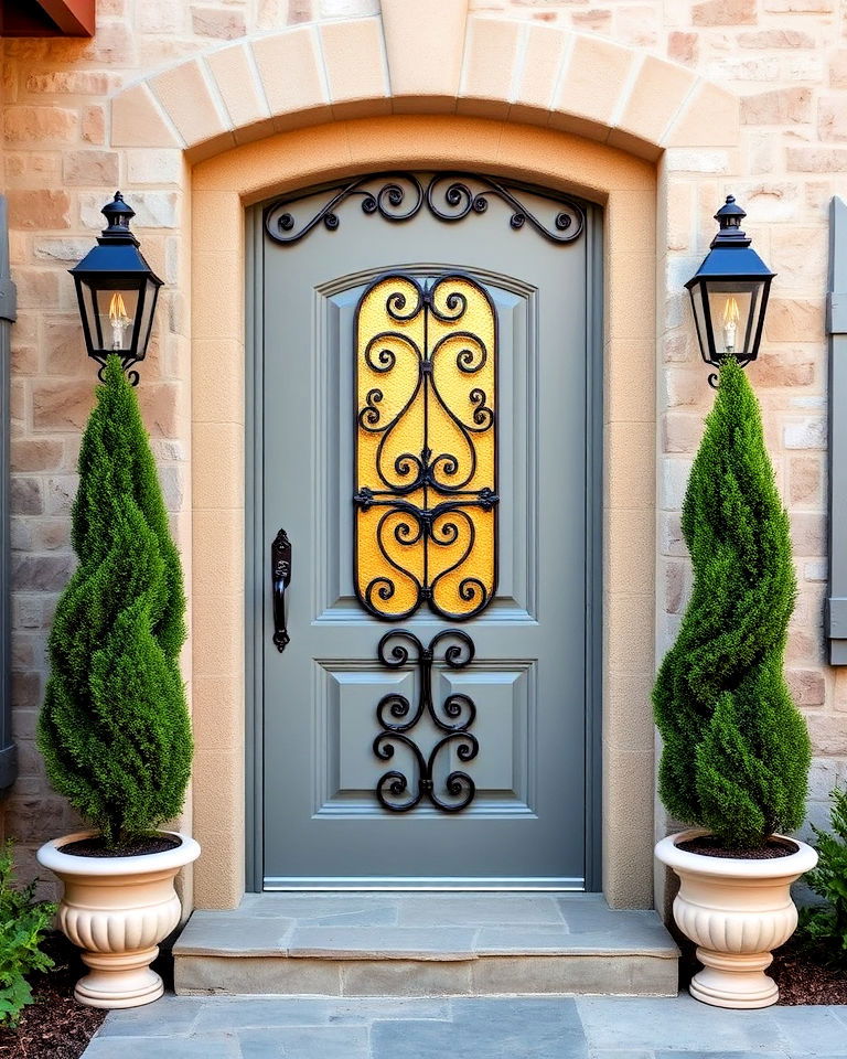 wrought iron detailing on medium grey front door - 25 Grey Front Door Ideas