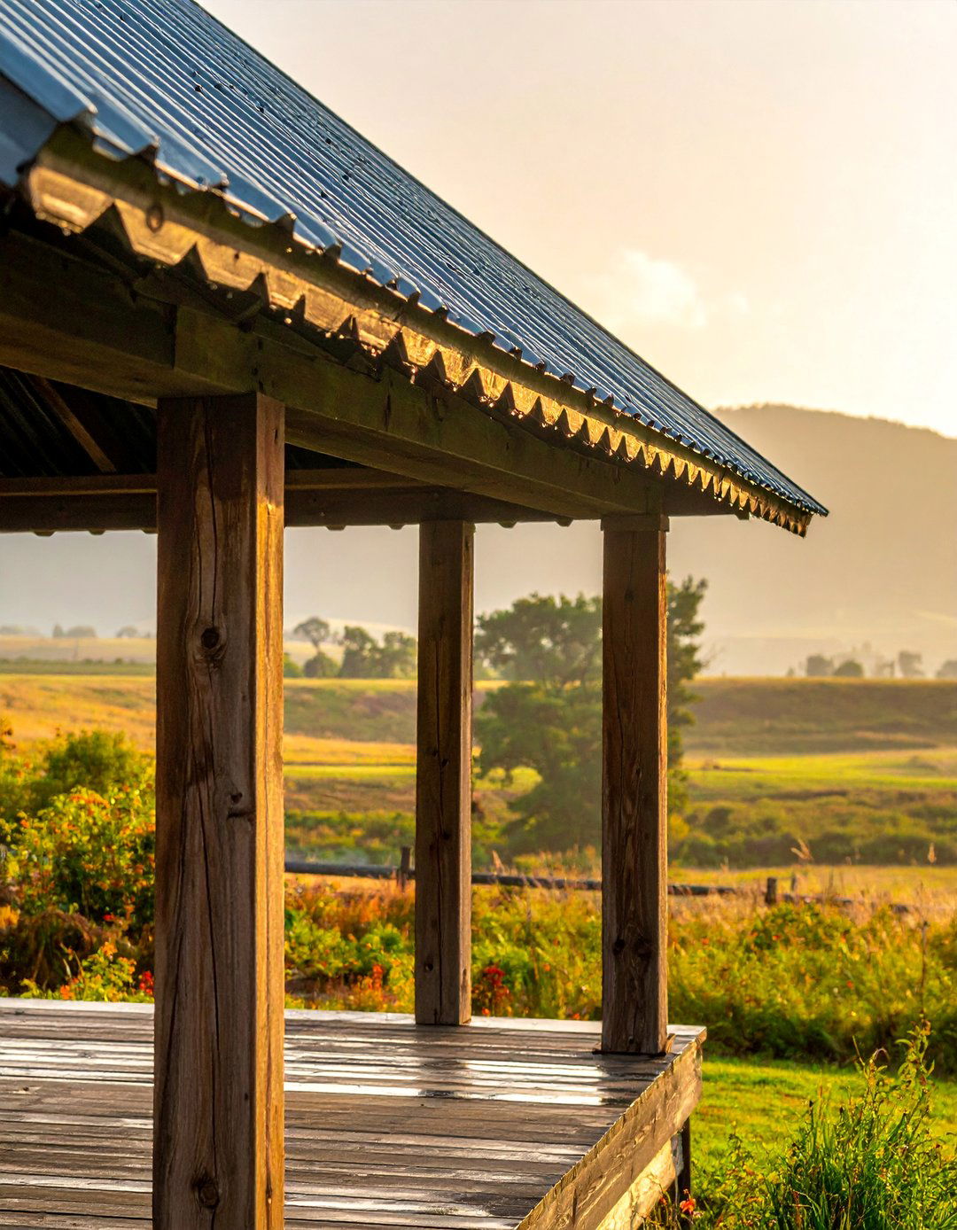 A Rustic Front Porch with a Tin Roof Overhang - 25 Rustic Front Porch Ideas for a Welcoming Entryway