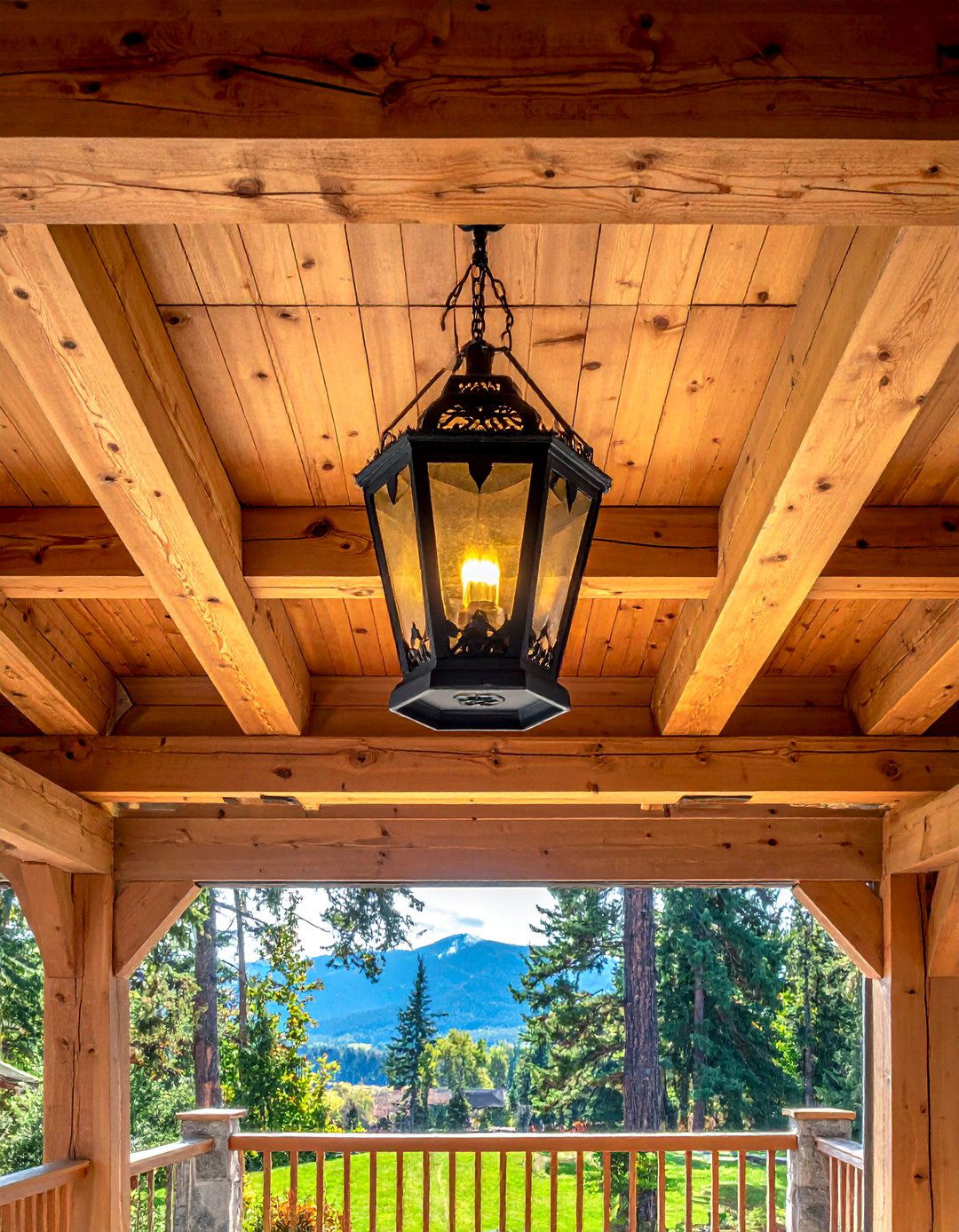 A Rustic Front Porch with an Exposed Cedar Beam Ceiling - 25 Rustic Front Porch Ideas for a Welcoming Entryway