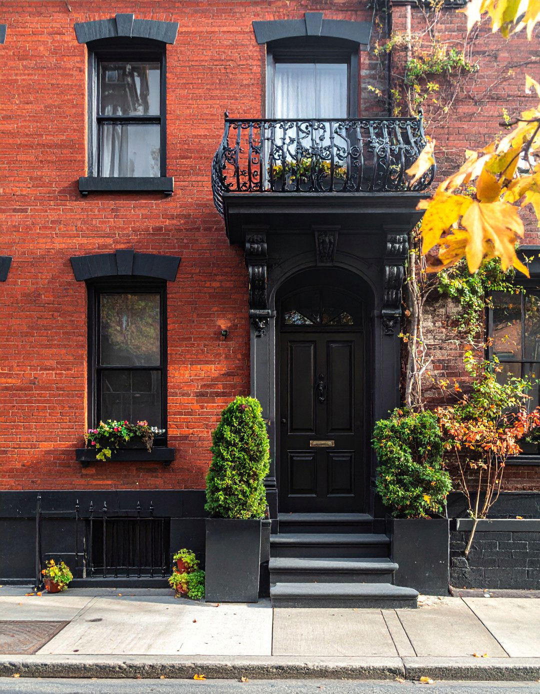 Black Brick House with a Juliet Balcony - 40 Black Brick House Exteriors for a Timeless and Elegant Look