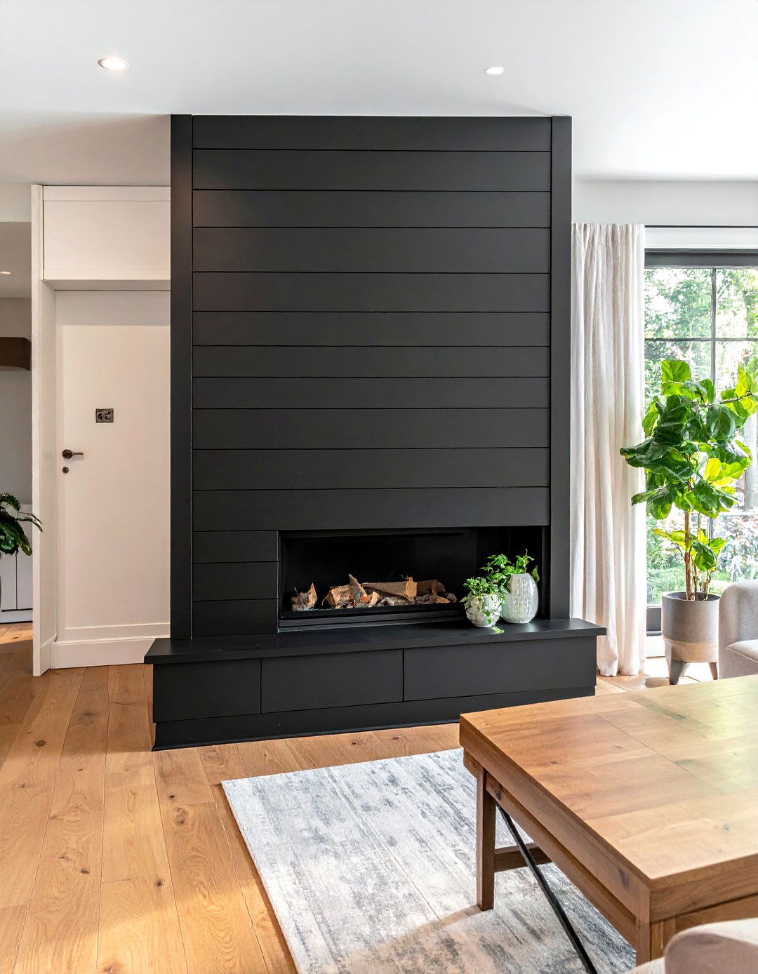 Black Shiplap Fireplace with a Hidden Storage Panel - 40 Black Shiplap Fireplace Ideas for a Bold and Cozy Focal Point