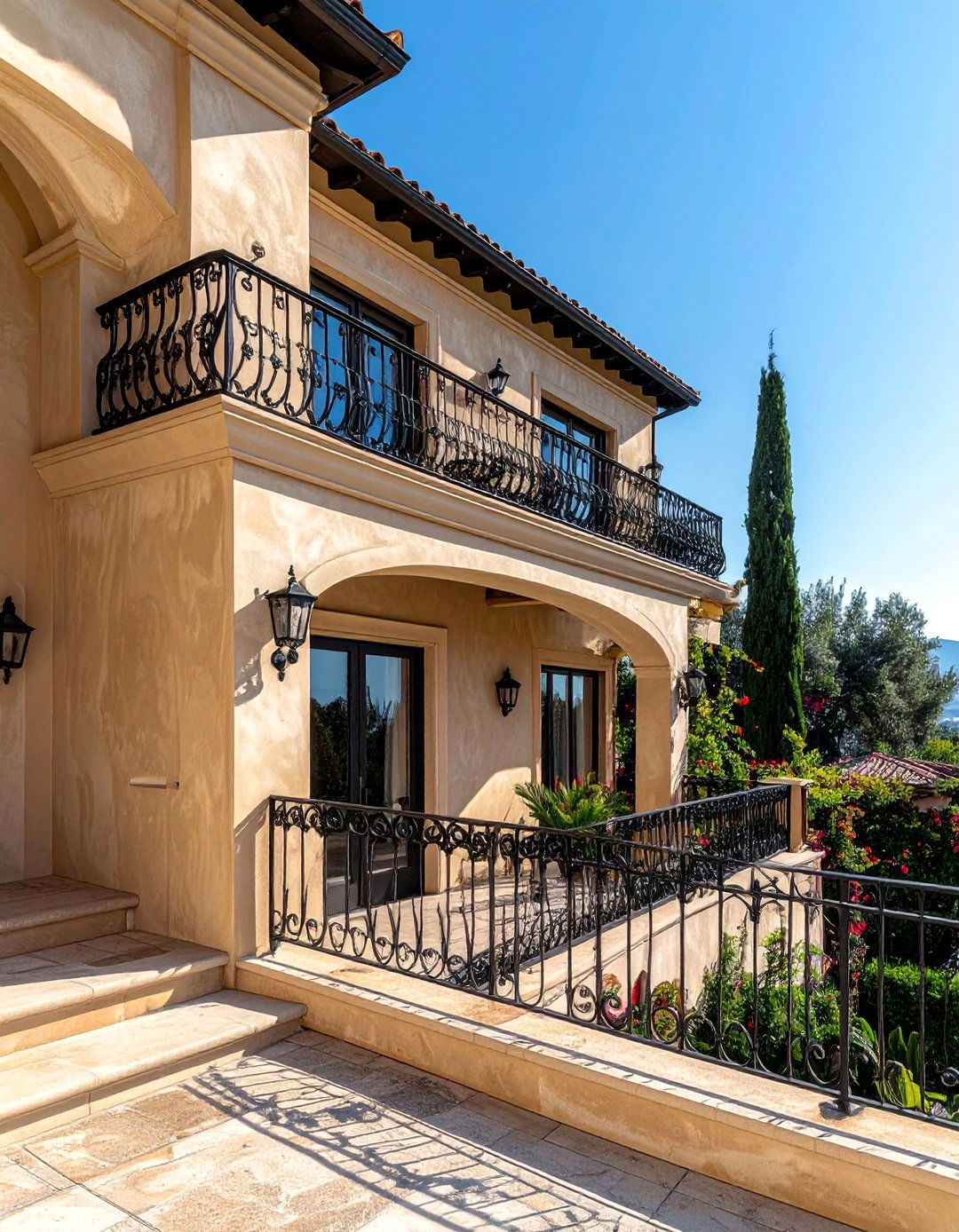 Creamy Beige Stucco with Black Wrought Iron Railings