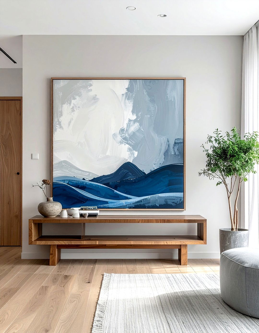 Create a Focal Point with a Single Statement Artwork - 30 Zen Living Room Ideas for a Peaceful Ambiance
