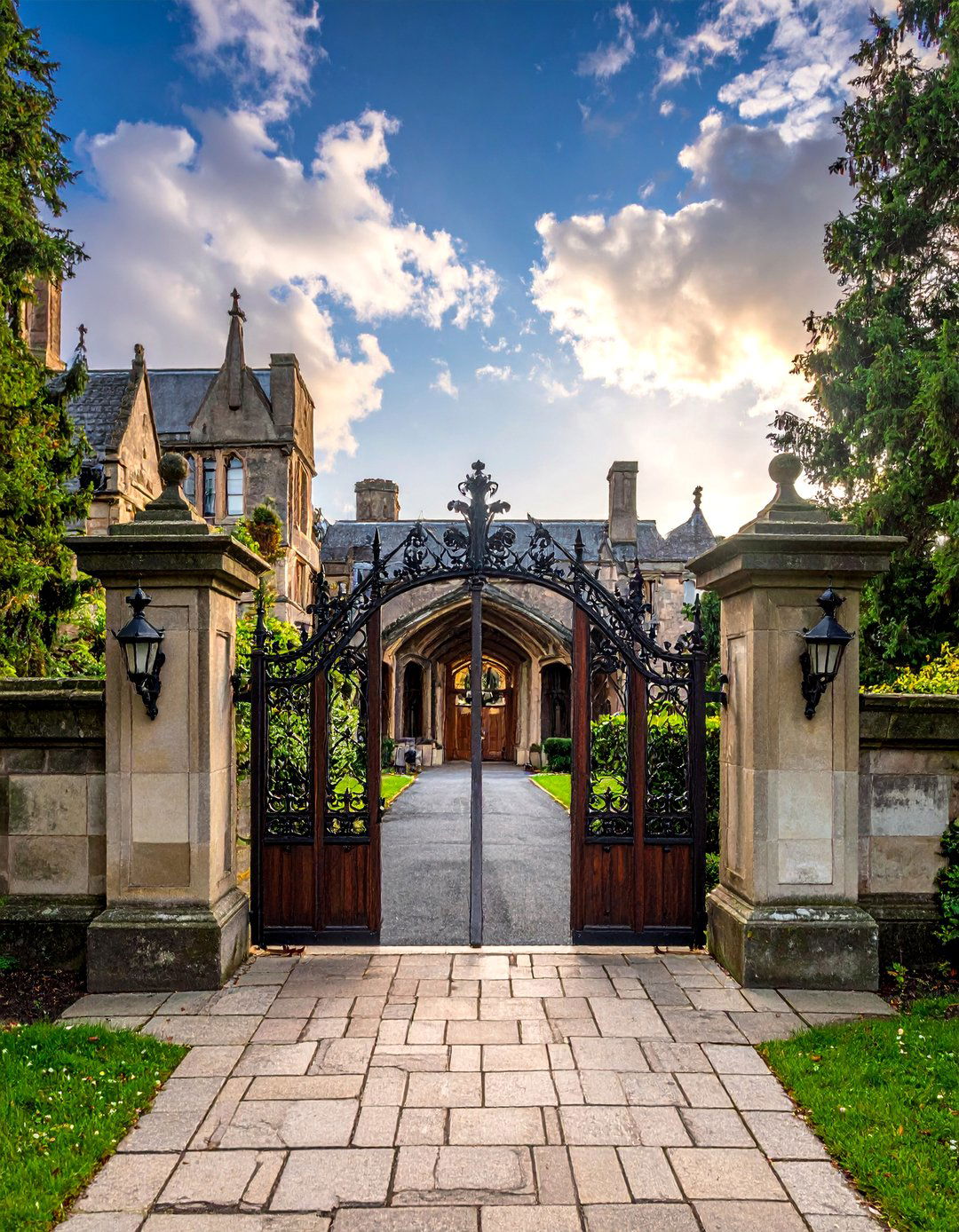 Grand Entrance with Wrought Iron Gates - 25 Gothic Castle Ideas for a Dramatic and Unique Home