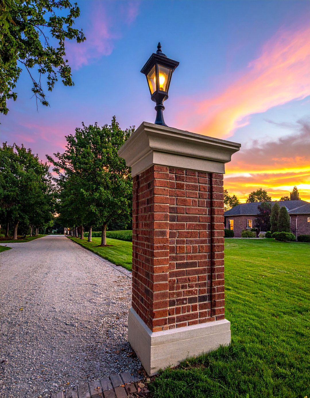 Ornate Brick Pillar with Lantern - 20 Brick Landscaping Ideas for Timeless Outdoor Charm