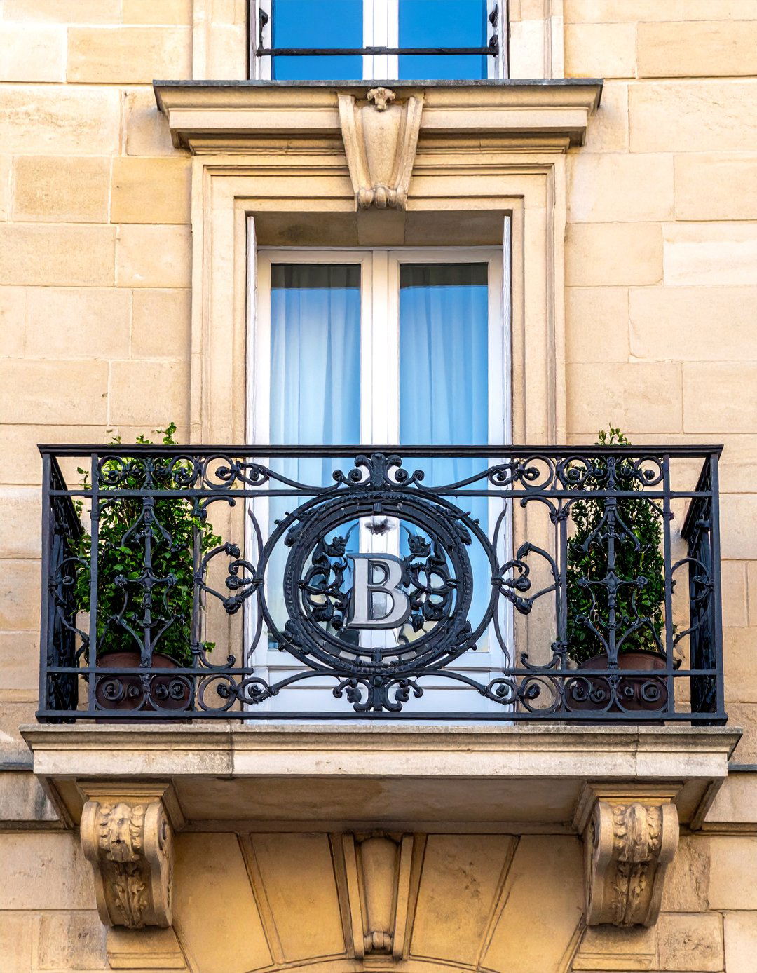 A French Balcony Featuring a Central Medallion - 25 French Balcony Ideas for a Charming Outdoor Space