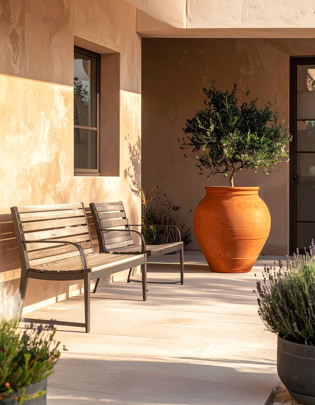A Minimalist Farmhouse Patio with Simple Furnishings - 25 Farmhouse Patio Ideas for a Relaxing Outdoor Space
