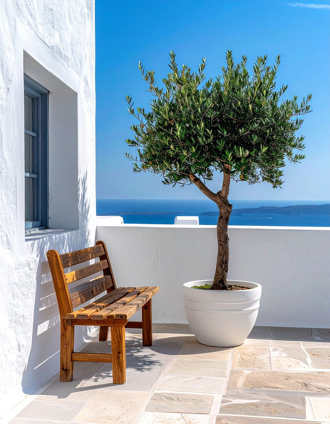 A Minimalist Mediterranean Balcony with Simple Furnishings - 20 Mediterranean Balcony Ideas for a Scenic Escape