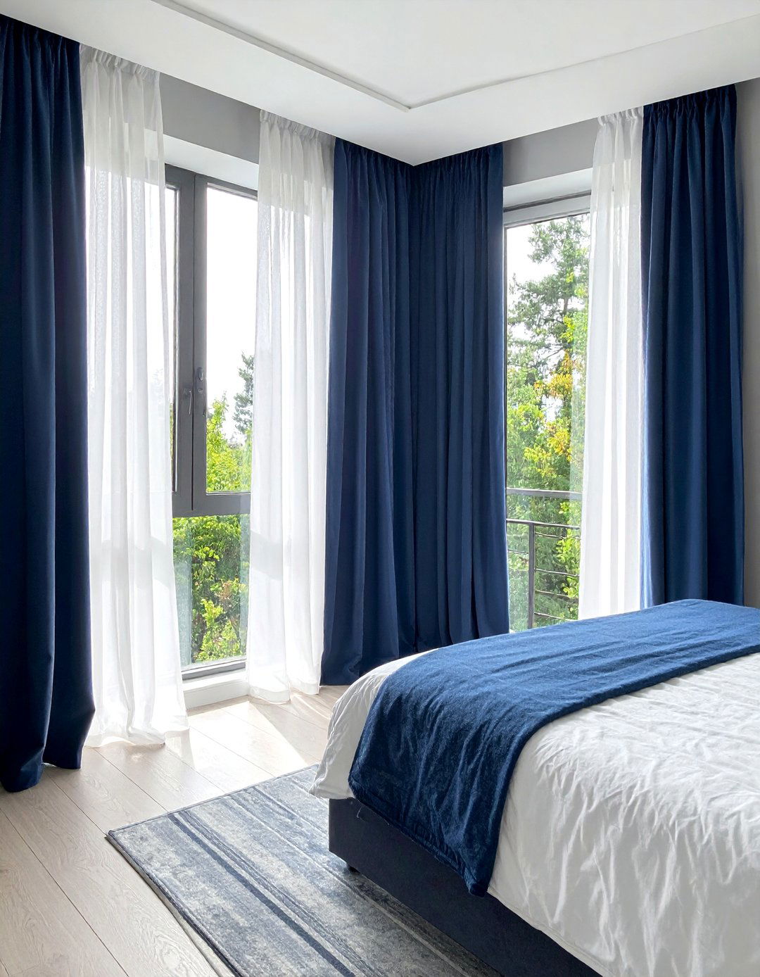 A Modern Bedroom with Sheer and Blackout Curtain Layers - 40 Modern Bedroom Ideas for a Sleek and Stylish Space