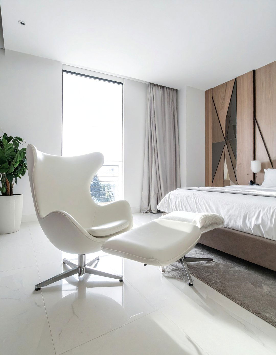 A Modern Bedroom with a Single Sculptural Chair - 40 Modern Bedroom Ideas for a Sleek and Stylish Space