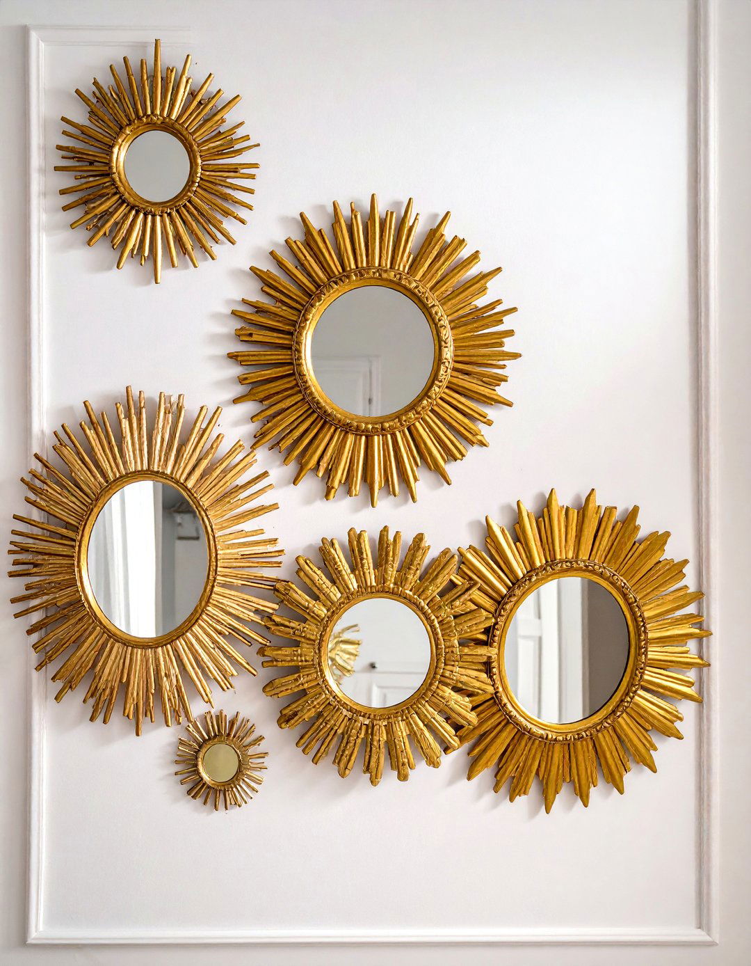Asymmetrical Sunburst Arrangement - 30 Mirror Gallery Wall Ideas to Elevate Your Decor