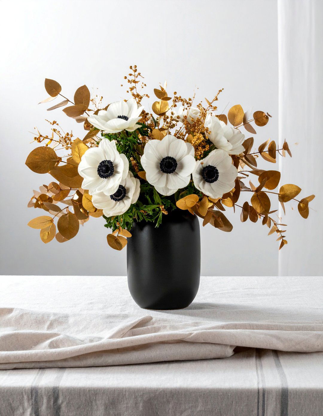 Black Anemone and Gold Leaf Floral Centerpiece - 20 Black and Gold Centerpiece Ideas for Elegant Tables