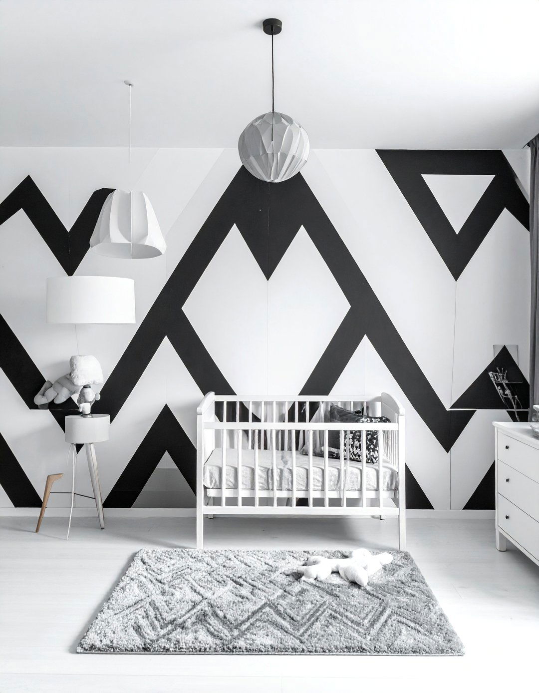 Black and White Nursery with a Geometric Accent Wall - 25 Black and White Nursery Ideas for Timeless Style