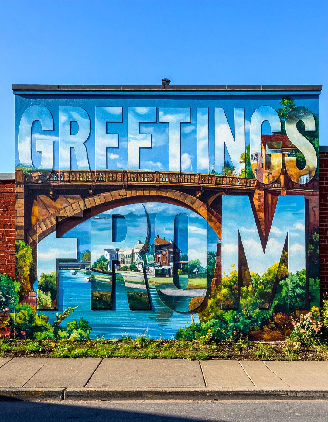 Greetings From Postcard Small Town Mural - 20 Small Town Murals to Brighten Up Your Community