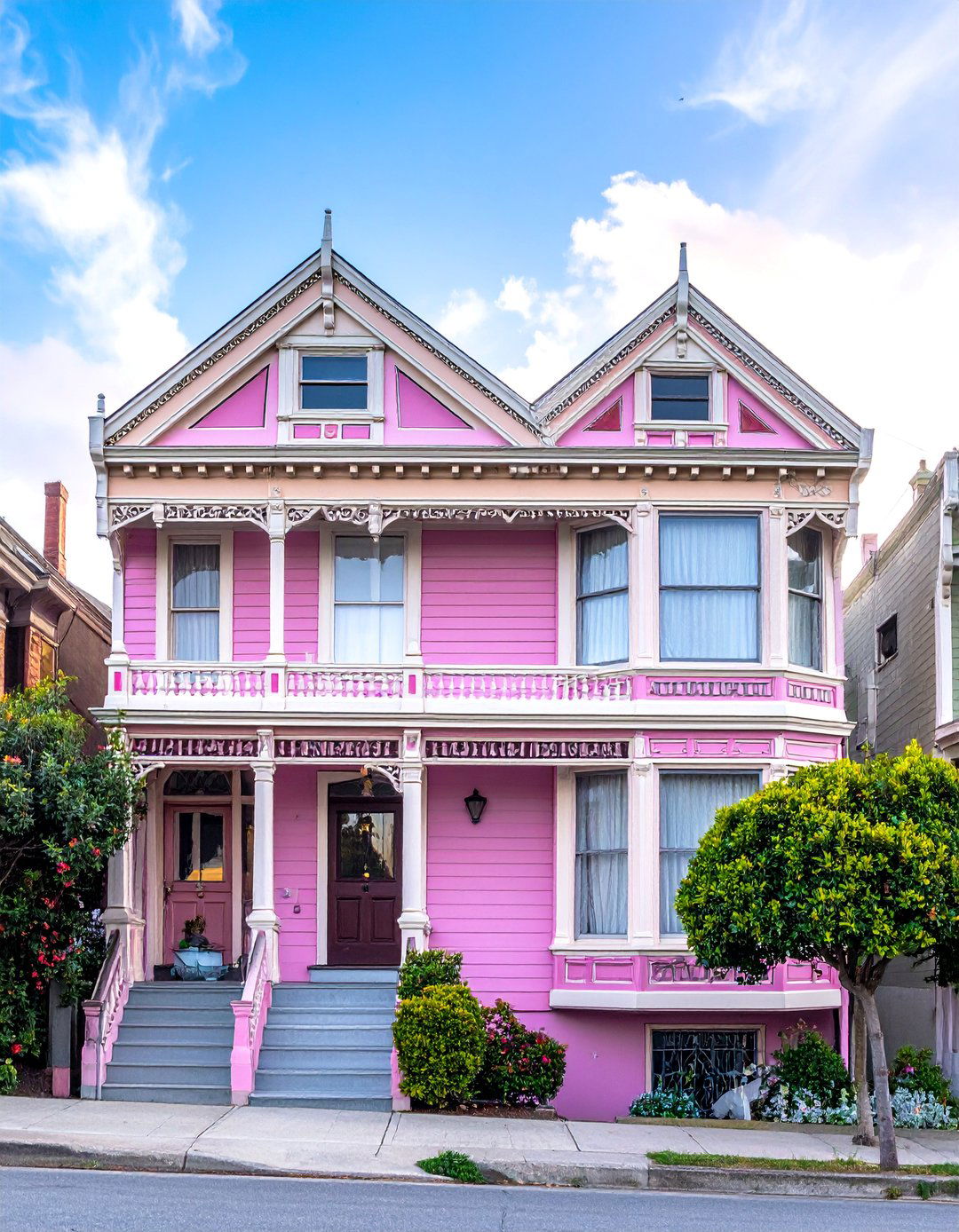 Pink Victorian House with a Multi Color Gingerbread Trim - 25 Pink Victorian House Ideas for a Charming Home