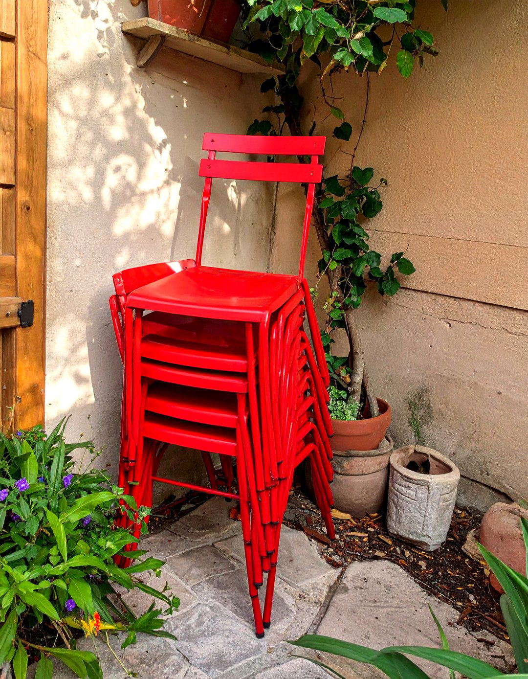Stackable Chairs for Easy Small Patio Storage - 40 Small Patio Ideas to Maximize Your Outdoor Space