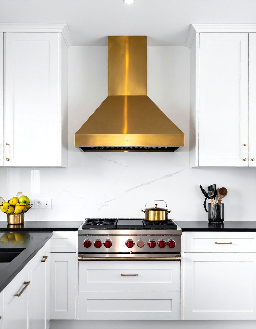 White Kitchen with Black Countertops and a Statement Range Hood - 40 White Kitchen Ideas with Black Countertops