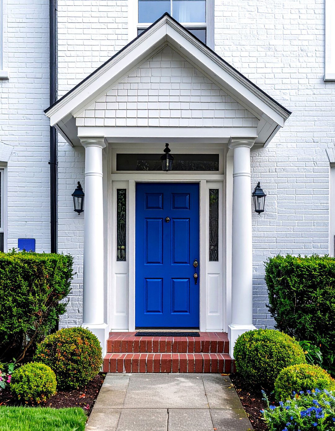 White Painted Brick with a Glossy Cobalt Blue Front Door - 20 White House With Blue Trim Design Ideas for Curb Appeal