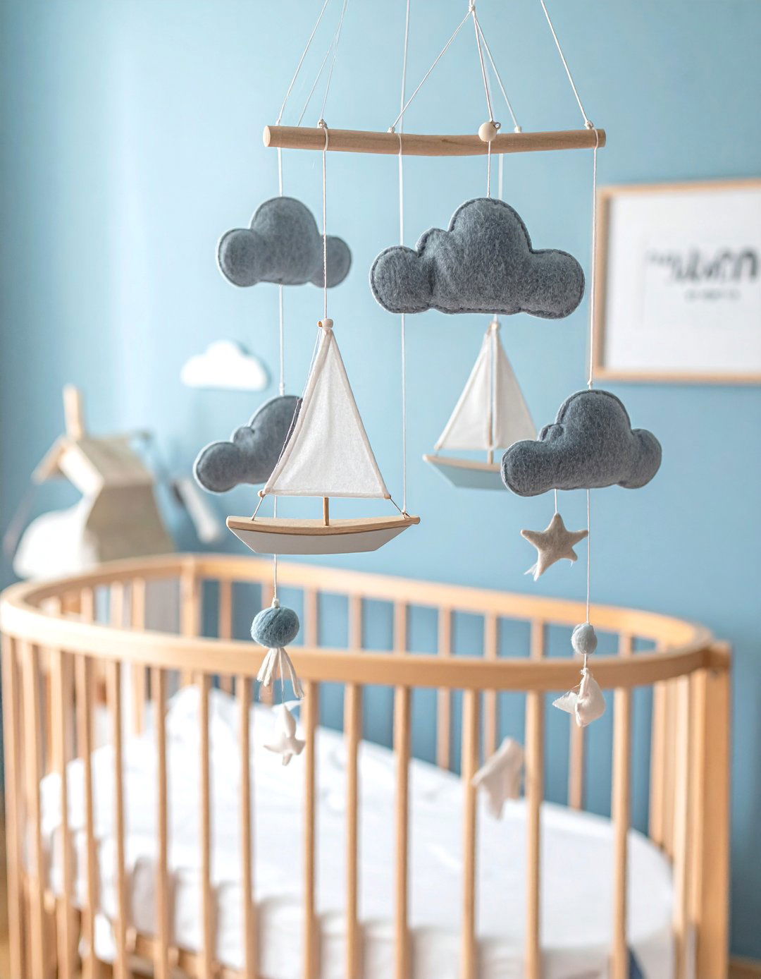 A Nautical Nursery with a Sailboat Mobile - 25 Nautical Nursery Ideas for a Coastal-Themed Baby Room