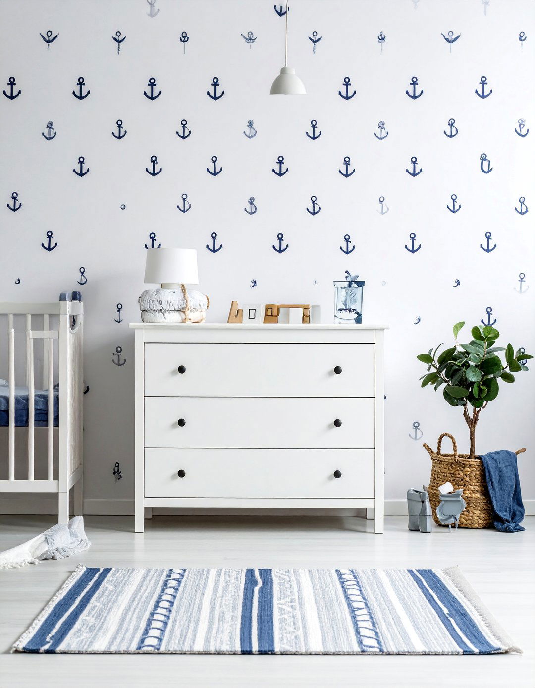 An Anchor Patterned Accent Wall for a Nautical Nursery - 25 Nautical Nursery Ideas for a Coastal-Themed Baby Room