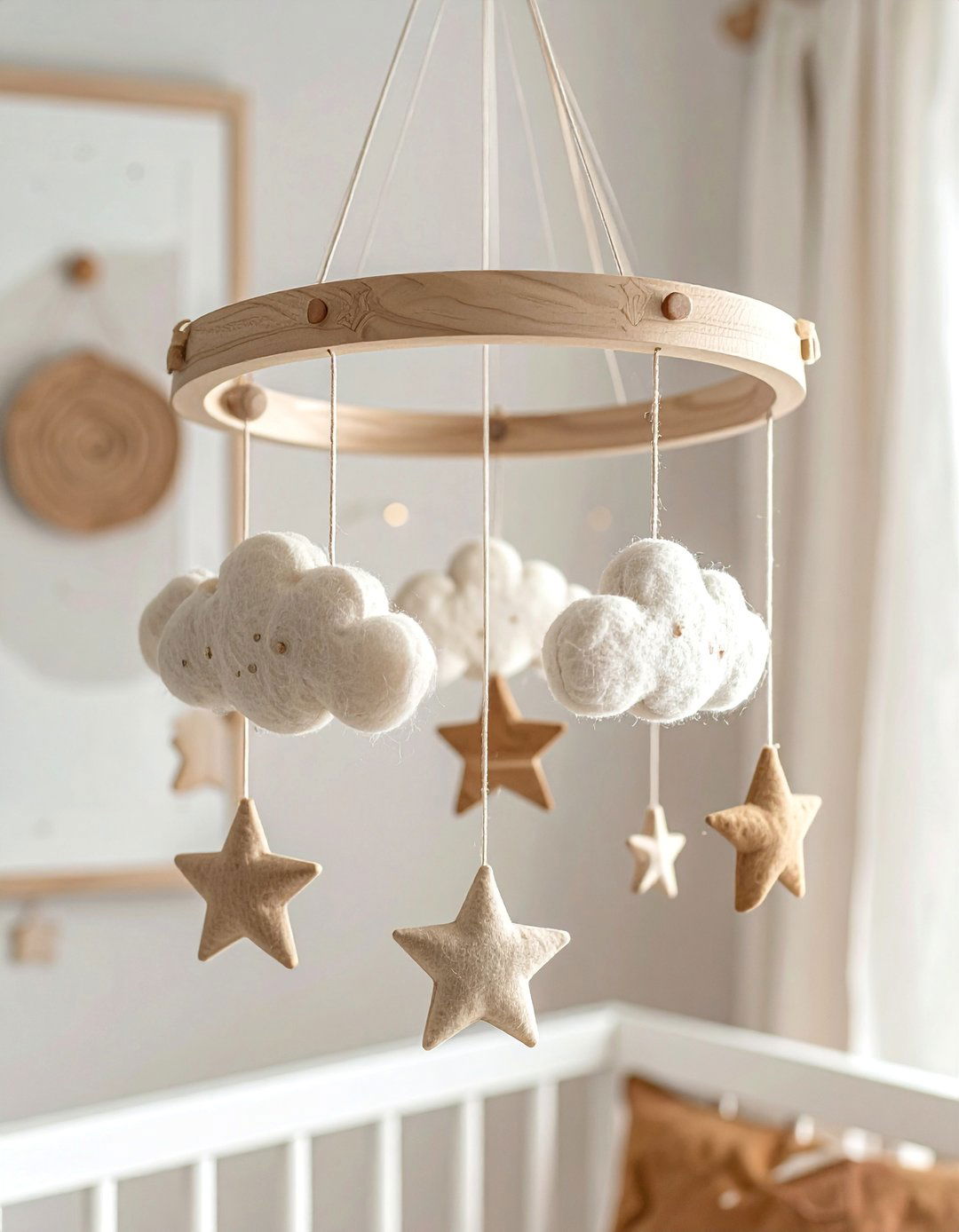 An Eclectic Mobile Above the Crib in a Boho Toddler Room - 20 Boho Toddler Room Ideas for a Chic and Playful Space