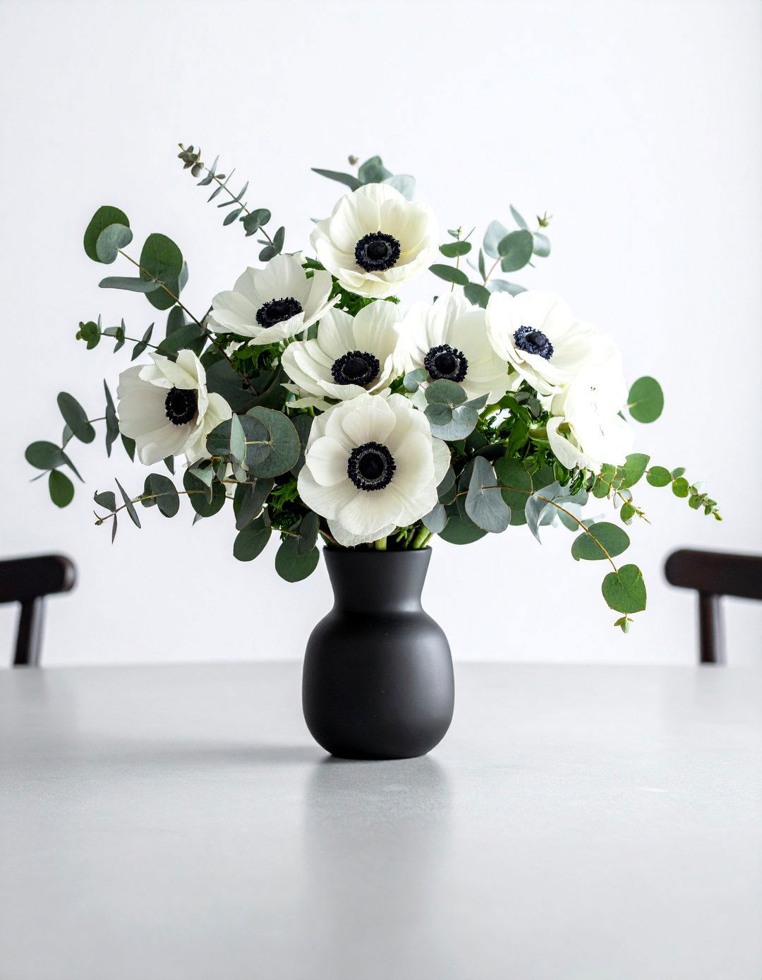 Anemone and Eucalyptus Spring Centerpiece - 25 Spring Centerpiece Ideas for a Fresh Look