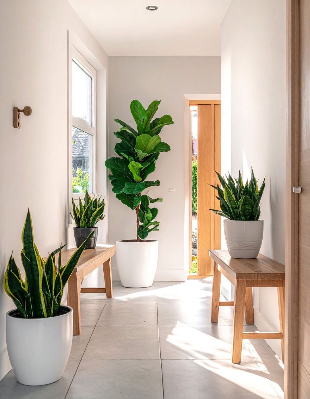 Biophilic Scandinavian Entryway with Potted Plants - 20 Scandinavian Entryway Ideas for a Cozy Home
