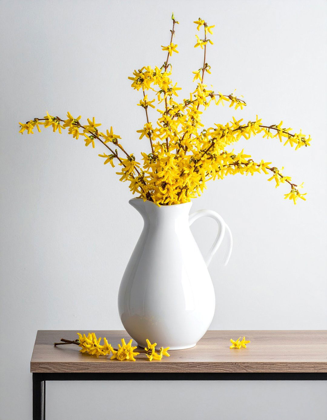 Forsythia Branch Spring Centerpiece in a Tall Vase - 25 Spring Centerpiece Ideas for a Fresh Look