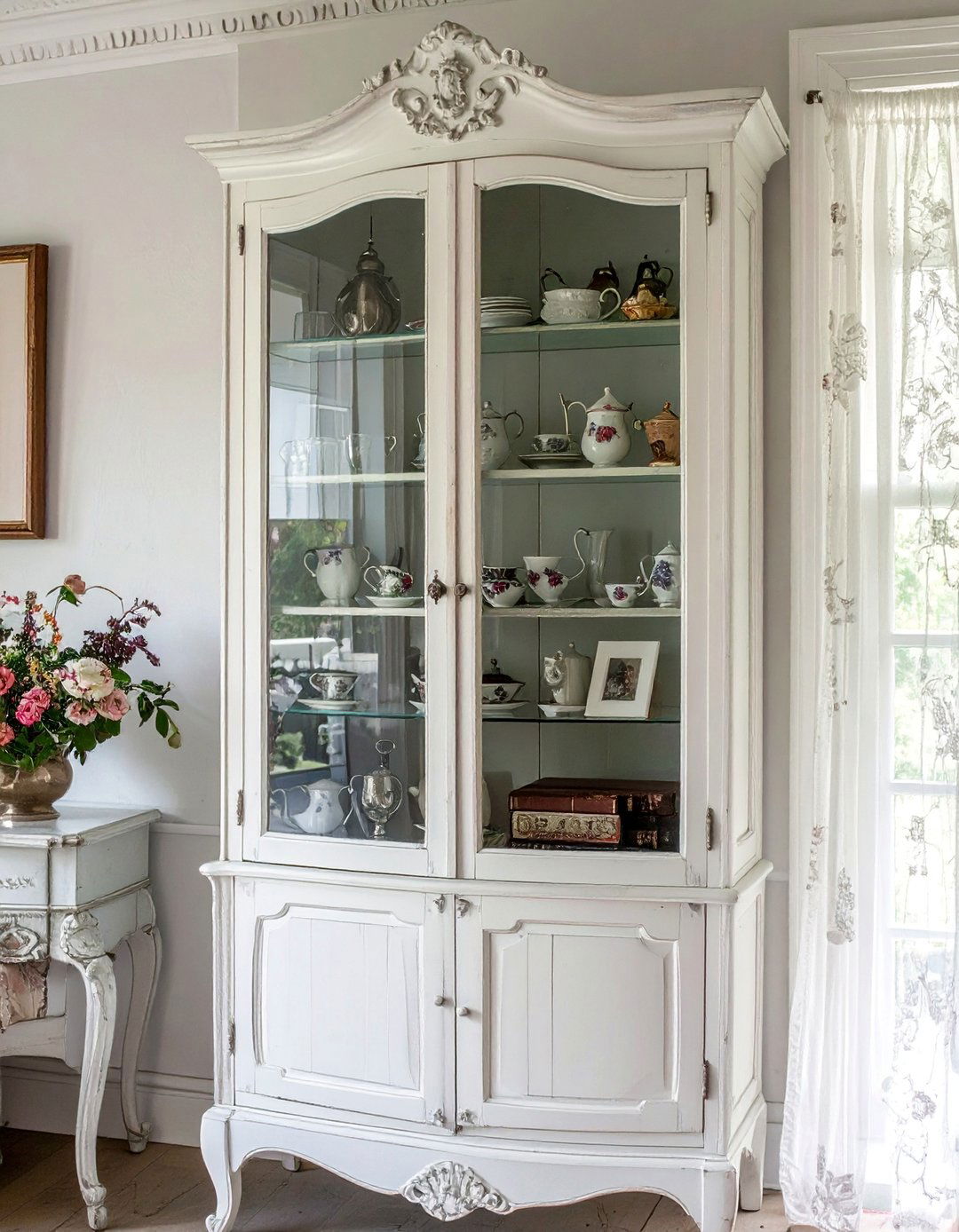 Glass Cabinet Displaying Antique Finds - 25 Shabby-chic Style Living Room Ideas for Charm