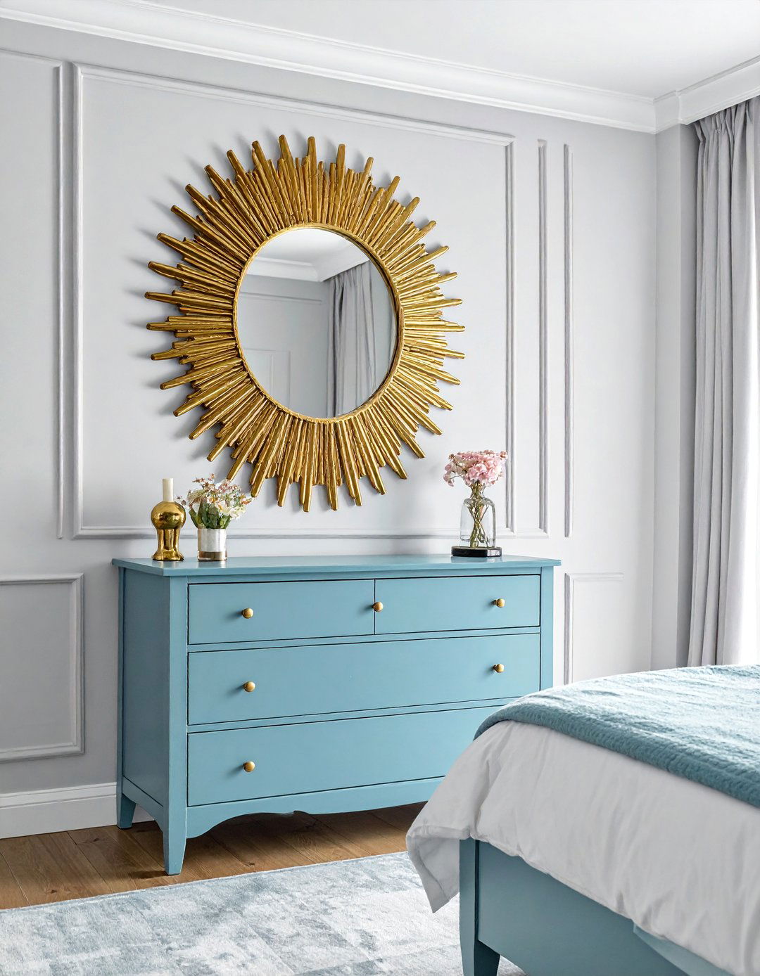 Gold Sunburst Mirror above a Blue Dresser - 20 Blue and Gold Bedroom Ideas for a Luxurious Look
