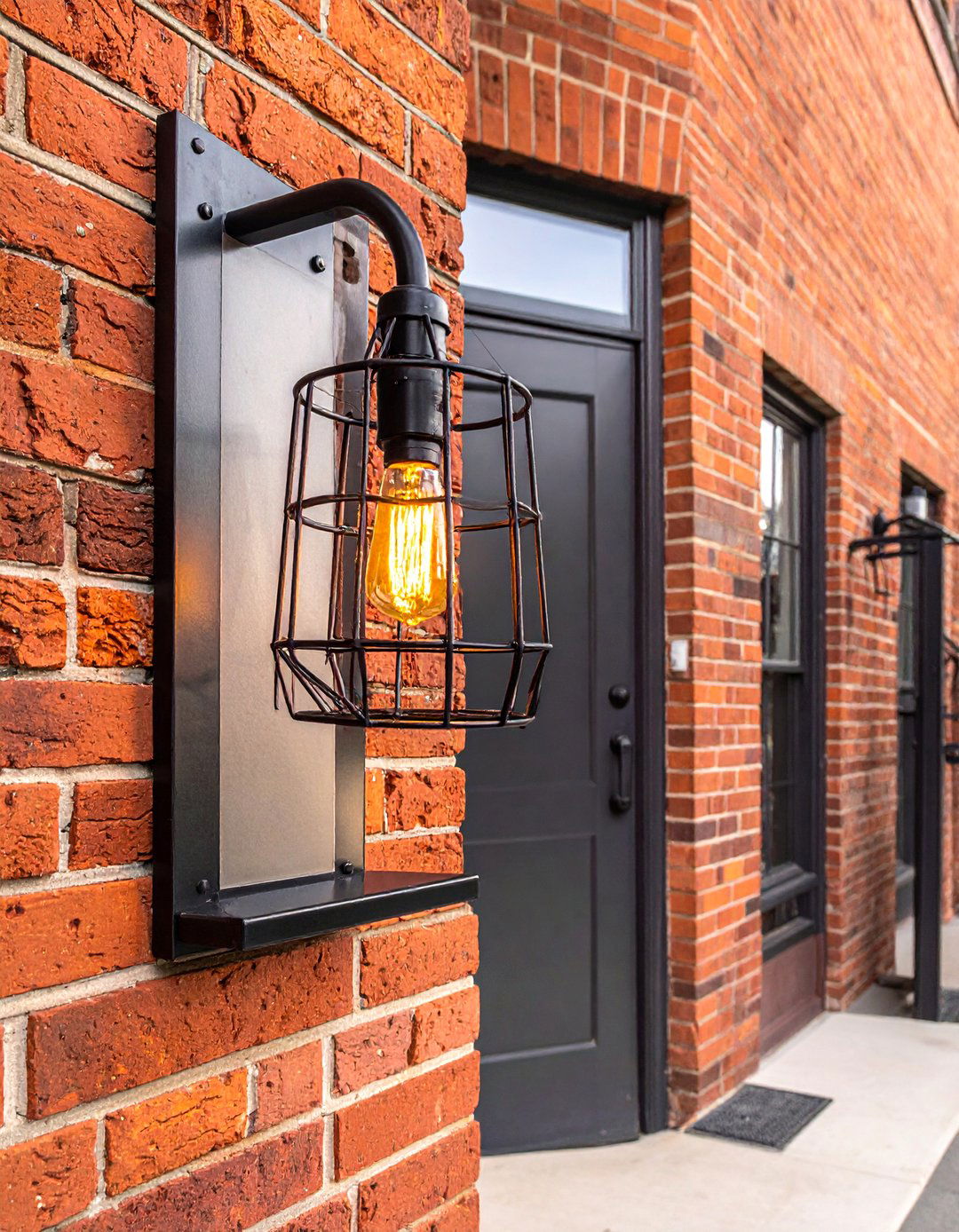 Industrial Inspired Cage Light Fixtures - 20 Front Porch Lighting Ideas to Enhance Your Home's Curb Appeal