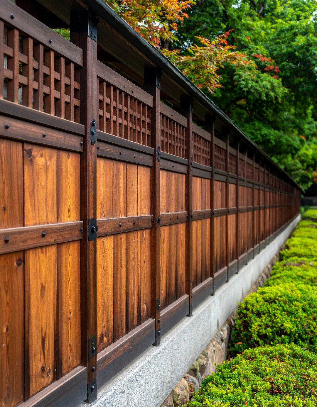 Japanese Style Wood Fence with Metal Brackets - 25 Metal and Wood Fence Ideas for Your Outdoor Space