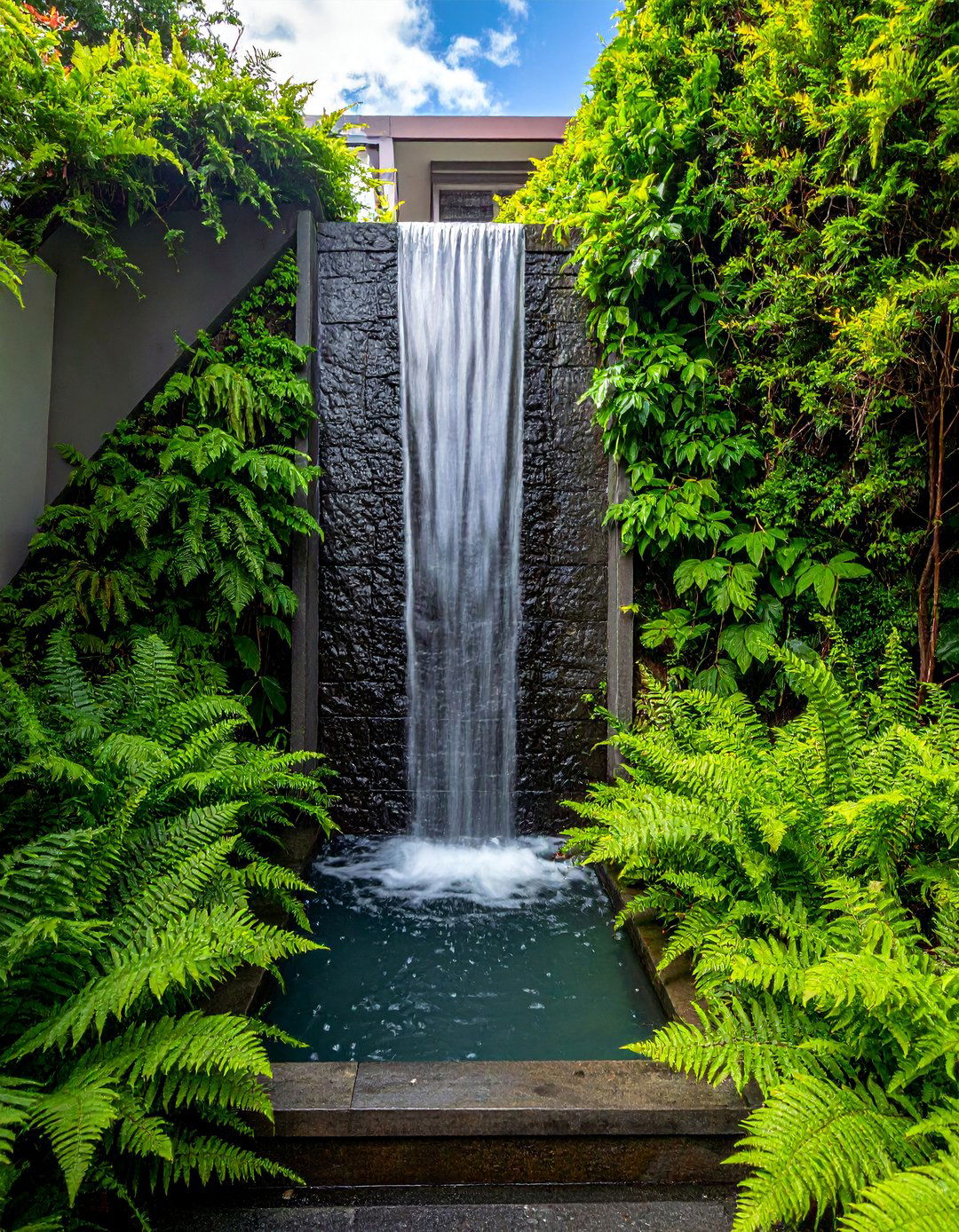 Water Feature as a Focal Point in a Narrow Garden - 20 Narrow Garden Ideas to Maximize Small Spaces