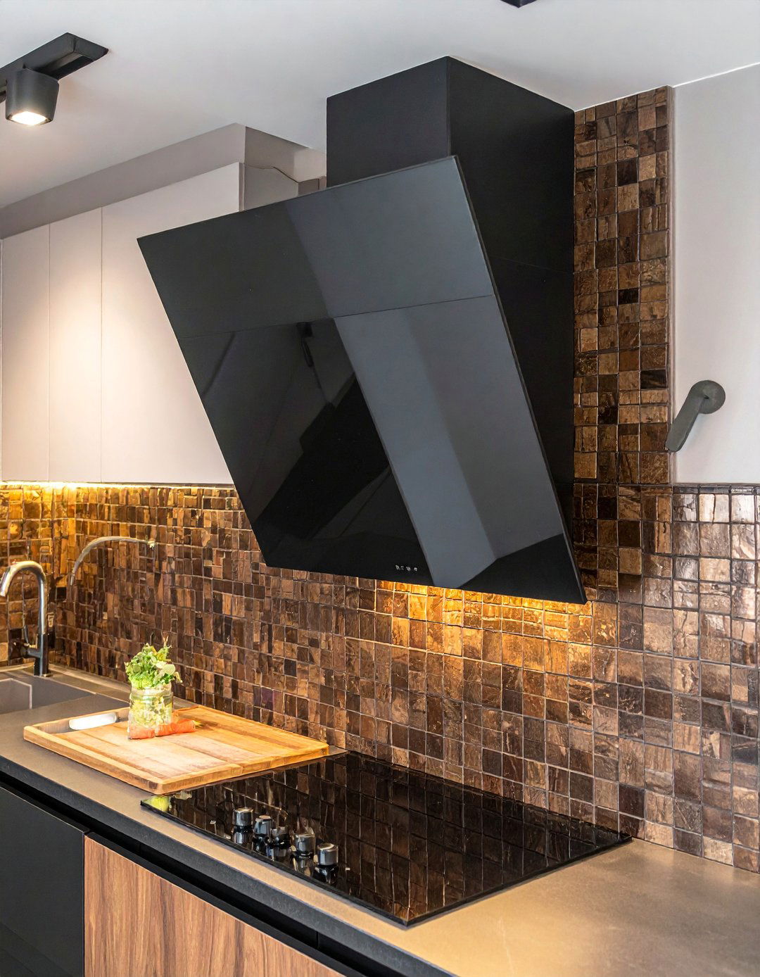 A Black Range Hood Over a Brown Tiled Wall - 20 Black and Brown Kitchen Ideas for a Warm Aesthetic