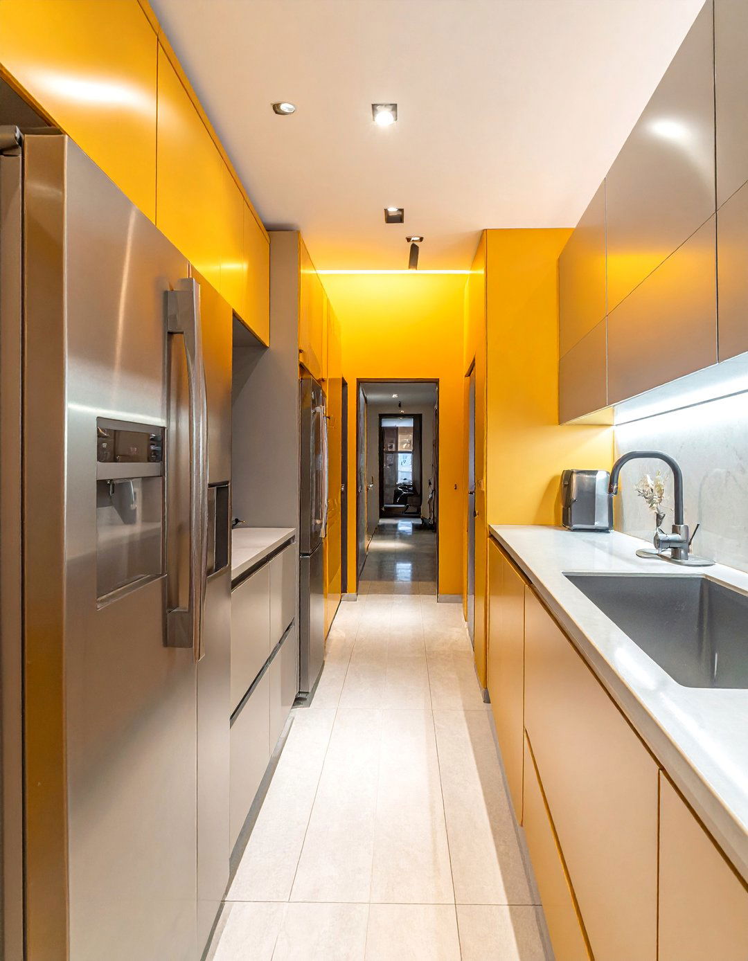 A Galley Kitchen Layout with Stainless Steel Appliances