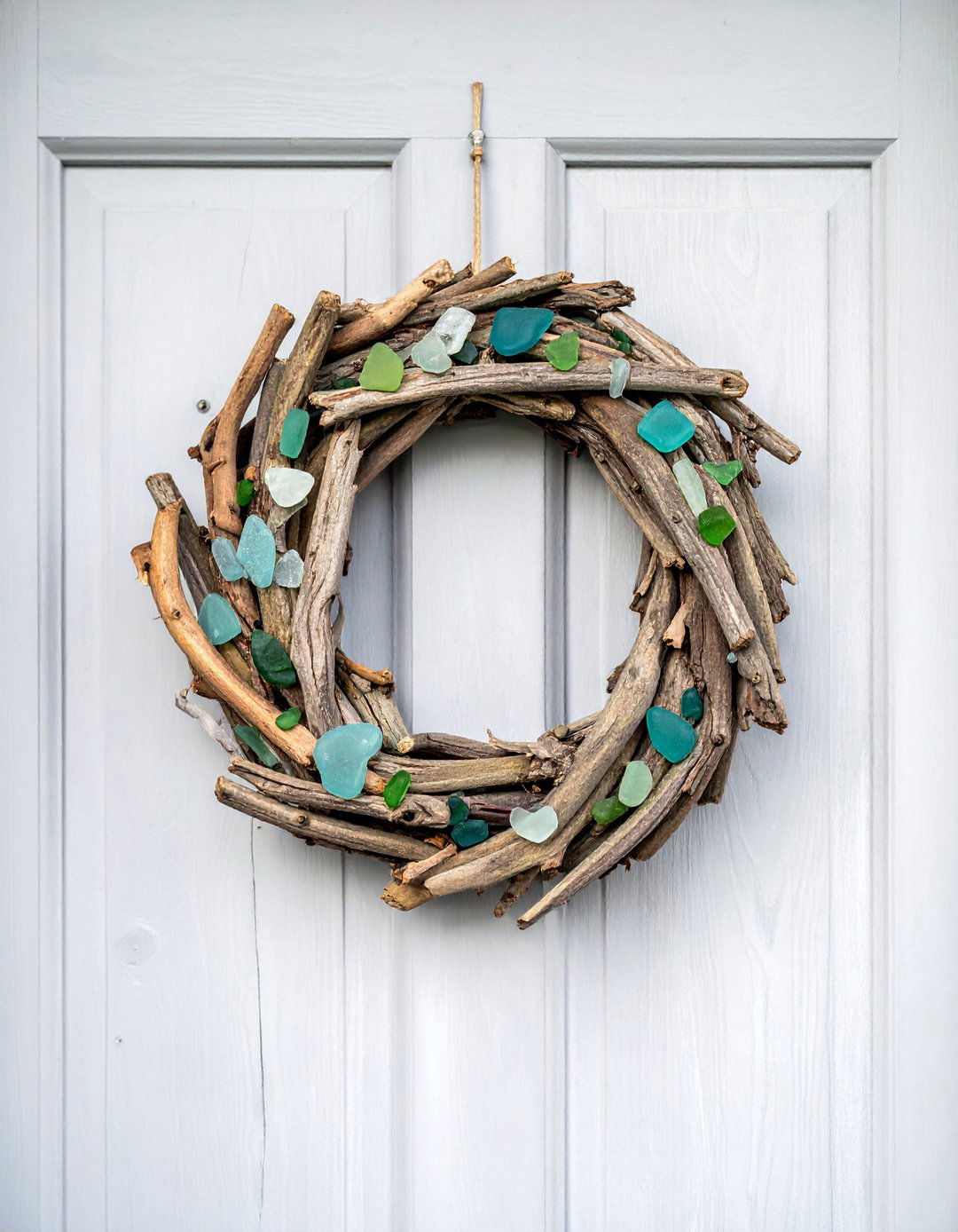 Beachy Driftwood and Sea Glass Wreath - 20 Summer Door Decoration Ideas to Welcome Guests