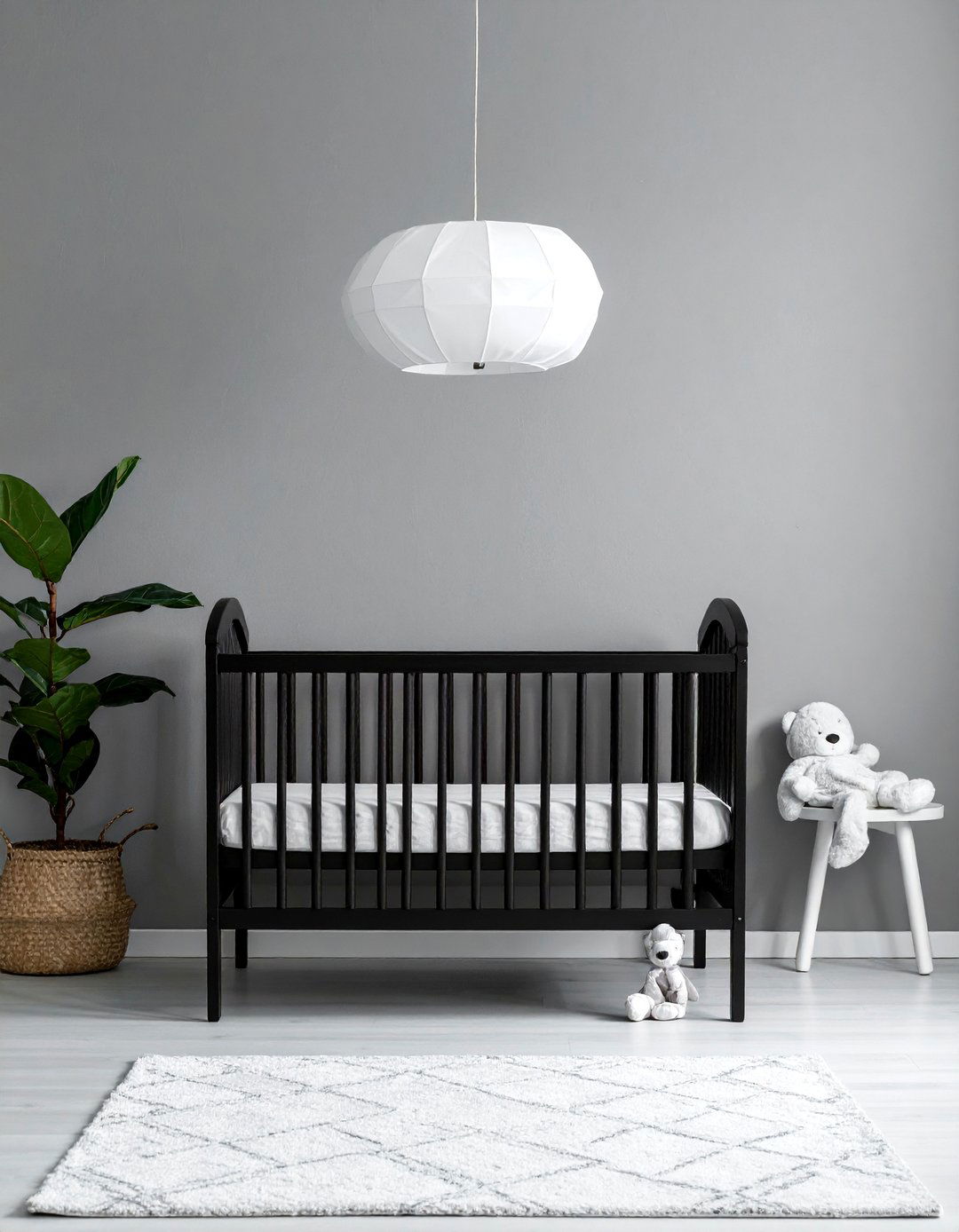 Black Crib as a Nursery Focal Point - 25 Black Nursery Ideas for a Modern Baby Room