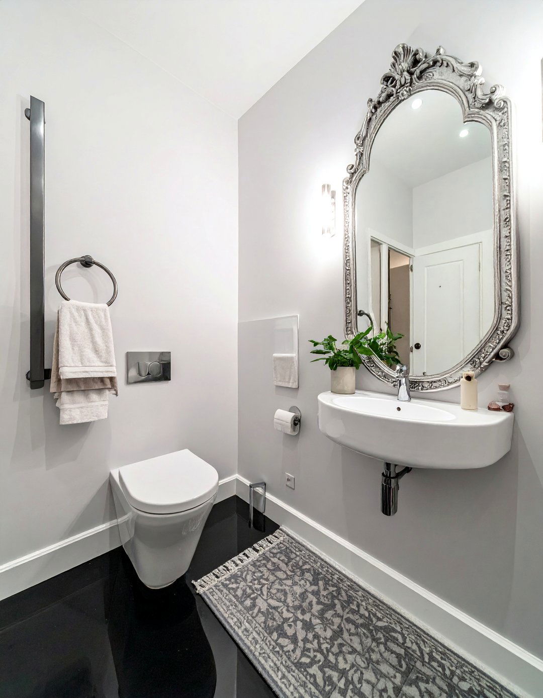 Black Floor in a Small Powder Room - 20 Black Floor Bathroom Ideas with White Walls