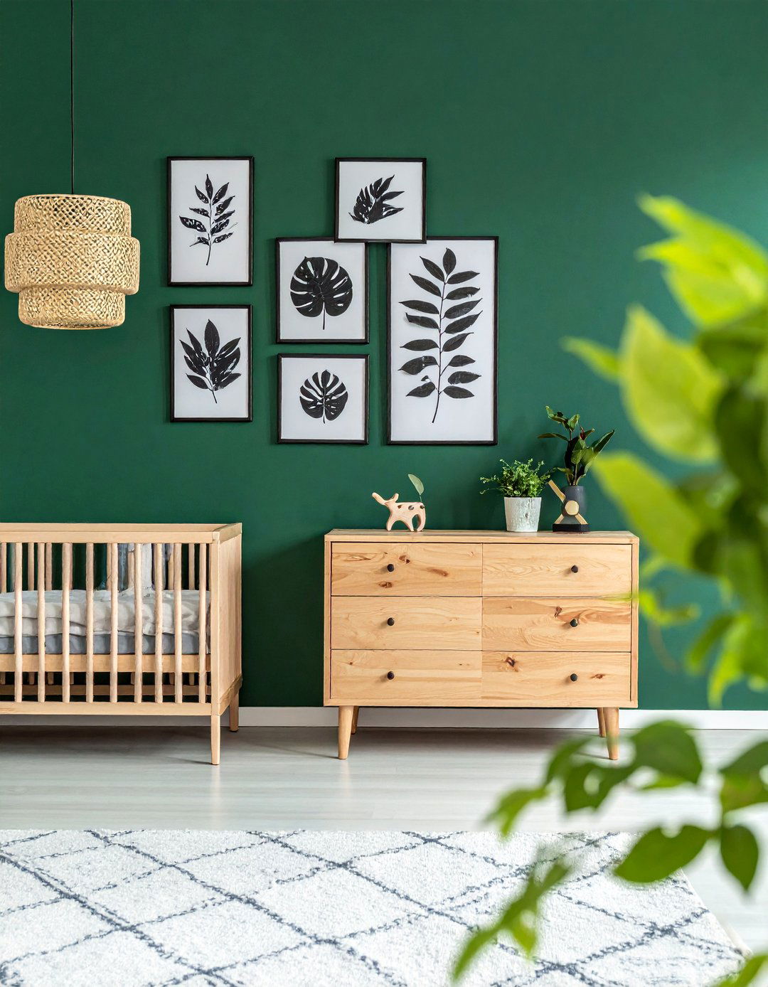 Forest Green Nursery with Botanical Prints - 25 Green Nursery Ideas for a Calming and Natural Space
