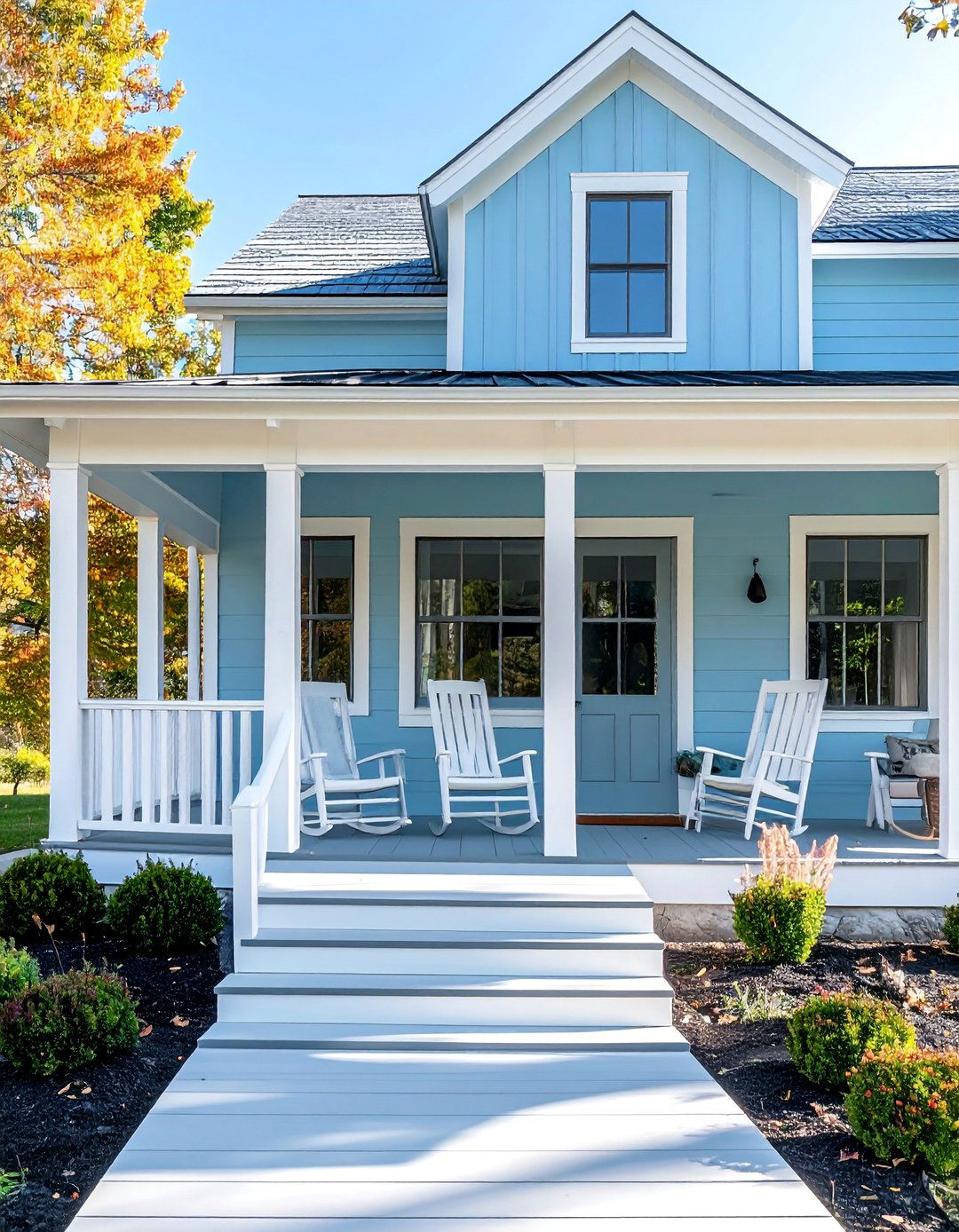 Light Blue Farmhouse with a Wraparound Porch - 25 Light Blue House Exterior Ideas for Curb Appeal