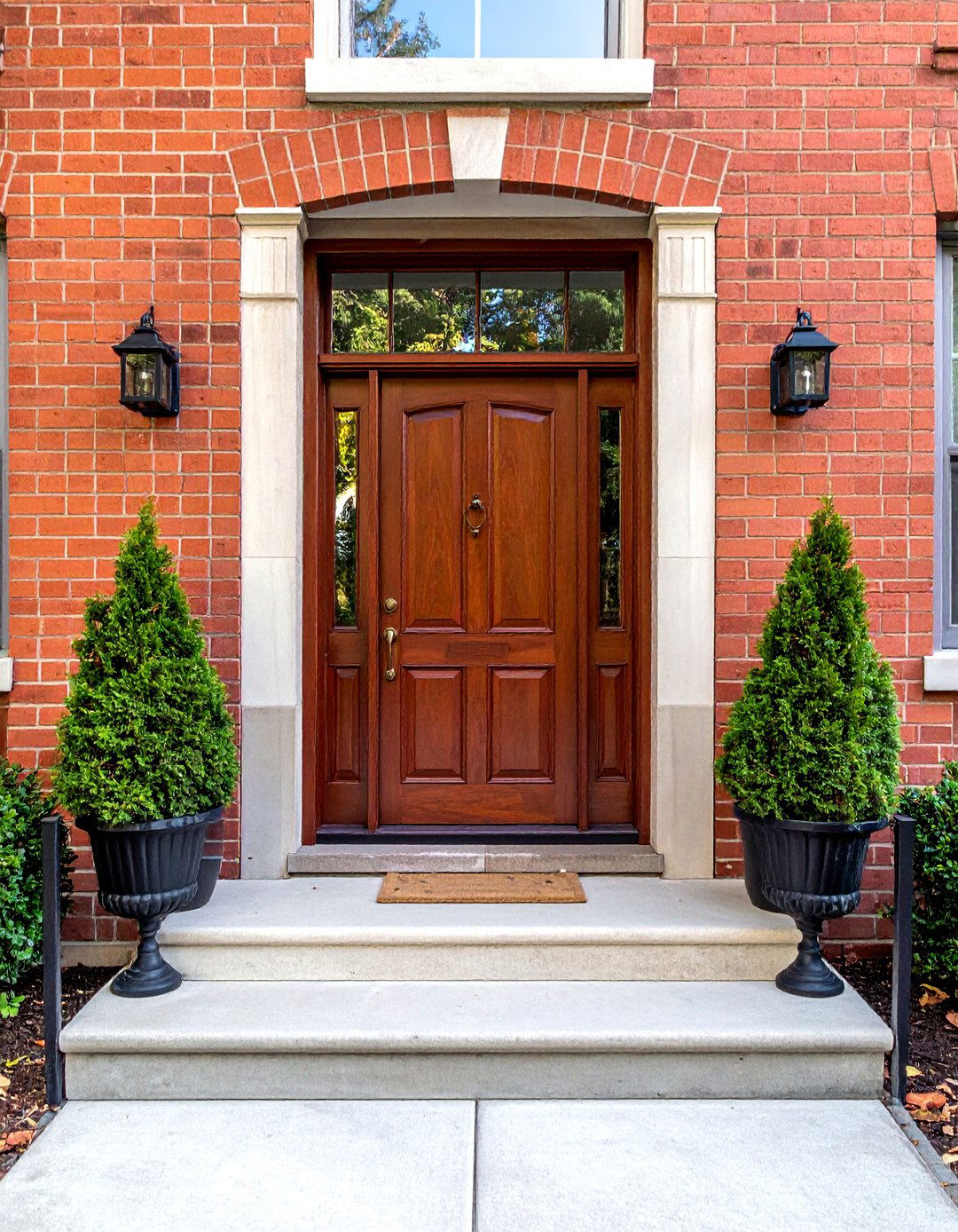 Mahogany Brown Front Door with a Transom Window - 15 Brown Front Door Ideas to Enhance Your Home's Curb Appeal