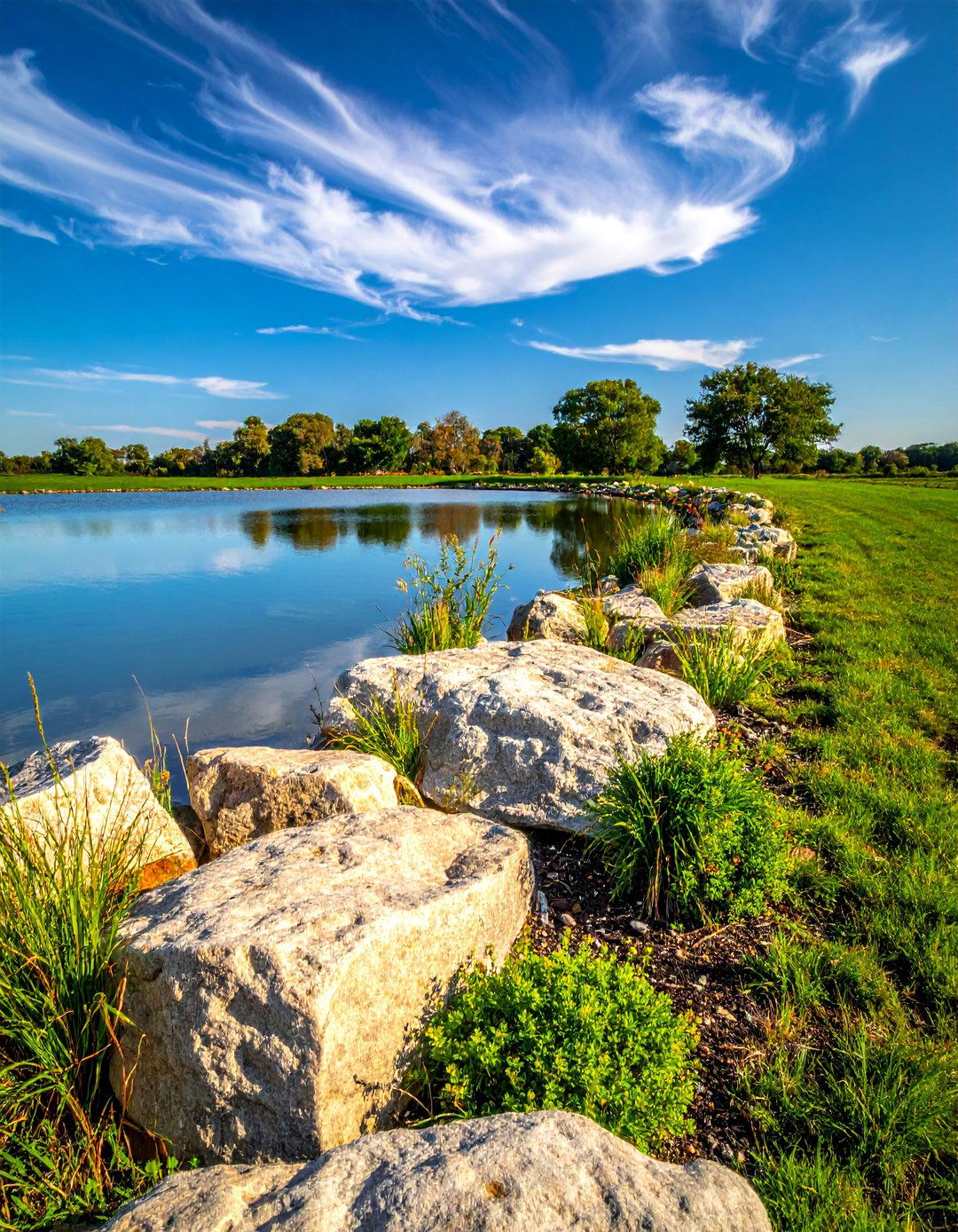 Natural Stone Shoreline Design - 15 Farm Pond Ideas to Enhance Your Rural Landscape