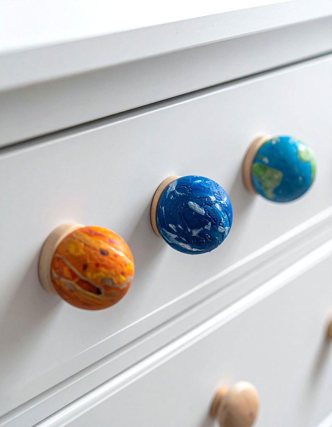 Nursery with Planet Inspired Dresser Knobs - 20 Space-themed Nursery Ideas for a Galactic Adventure