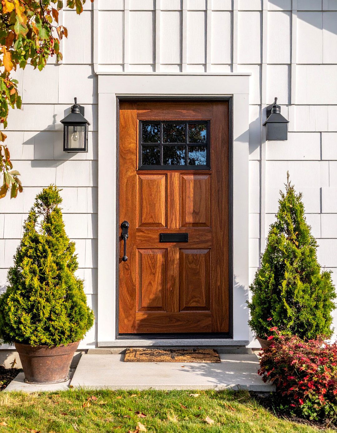 Rich Walnut Stained Front Door with Speakeasy Window - 25 Elegant Stained Front Door Ideas for Curb Appeal